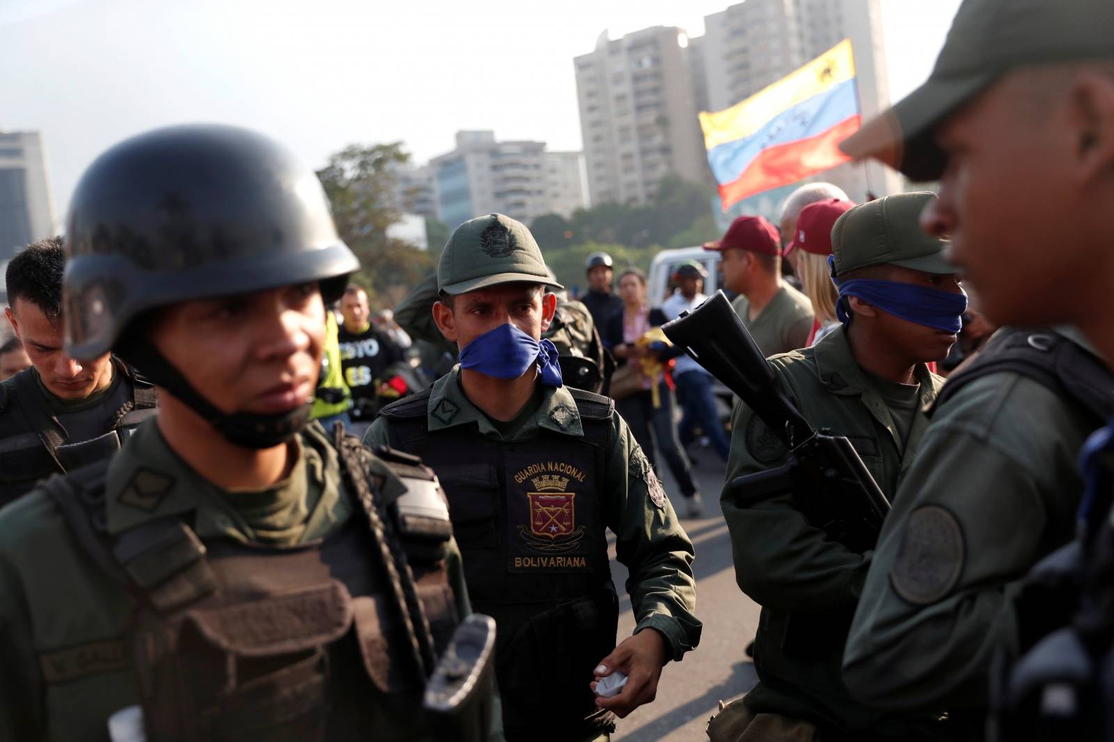 Military members stand near the Generalisimo Francisco de Miranda Airbase in Caracas