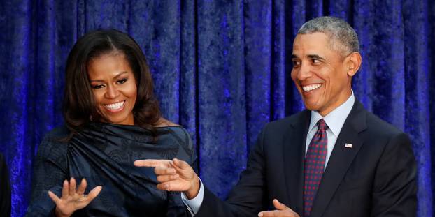 FILE PHOTO: Former U.S. President Obama and first lady Michelle Obama acknowledge guests during  portraits unveiling at the Smithsonianâs National Portrait Gallery in Washington