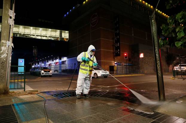 Local workers clean the streets as a precautionary measure, amid the coronavirus disease (COVID-19) outbreak, in Vina del Mar