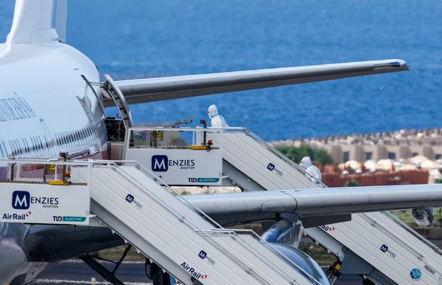 Passengers of the cruise ship MV Hondius, which was affected by a hantavirus outbreak, arrive at Tenerife Sud airport