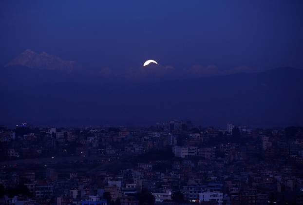 The "supermoon" rise above the valley in Kathmandu