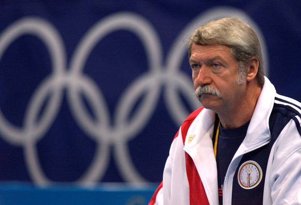 FILE PHOTO: Hungarian Bela Karolyi, coach of the U.S. gymnastics team, watches over training at the Sydney Superdrome