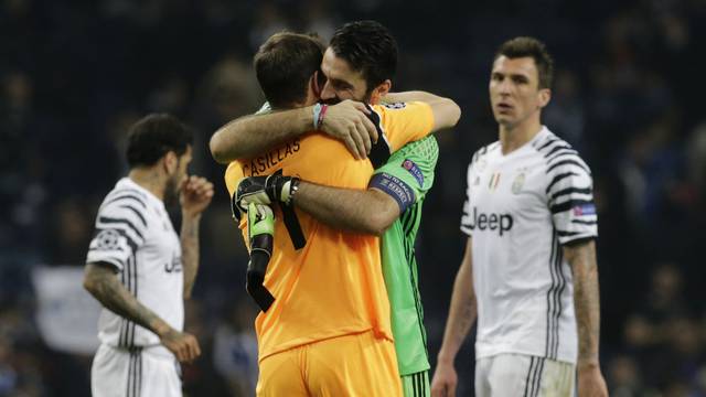 Juventus' Gianluigi Buffon with FC Porto's Iker Casillas after the match