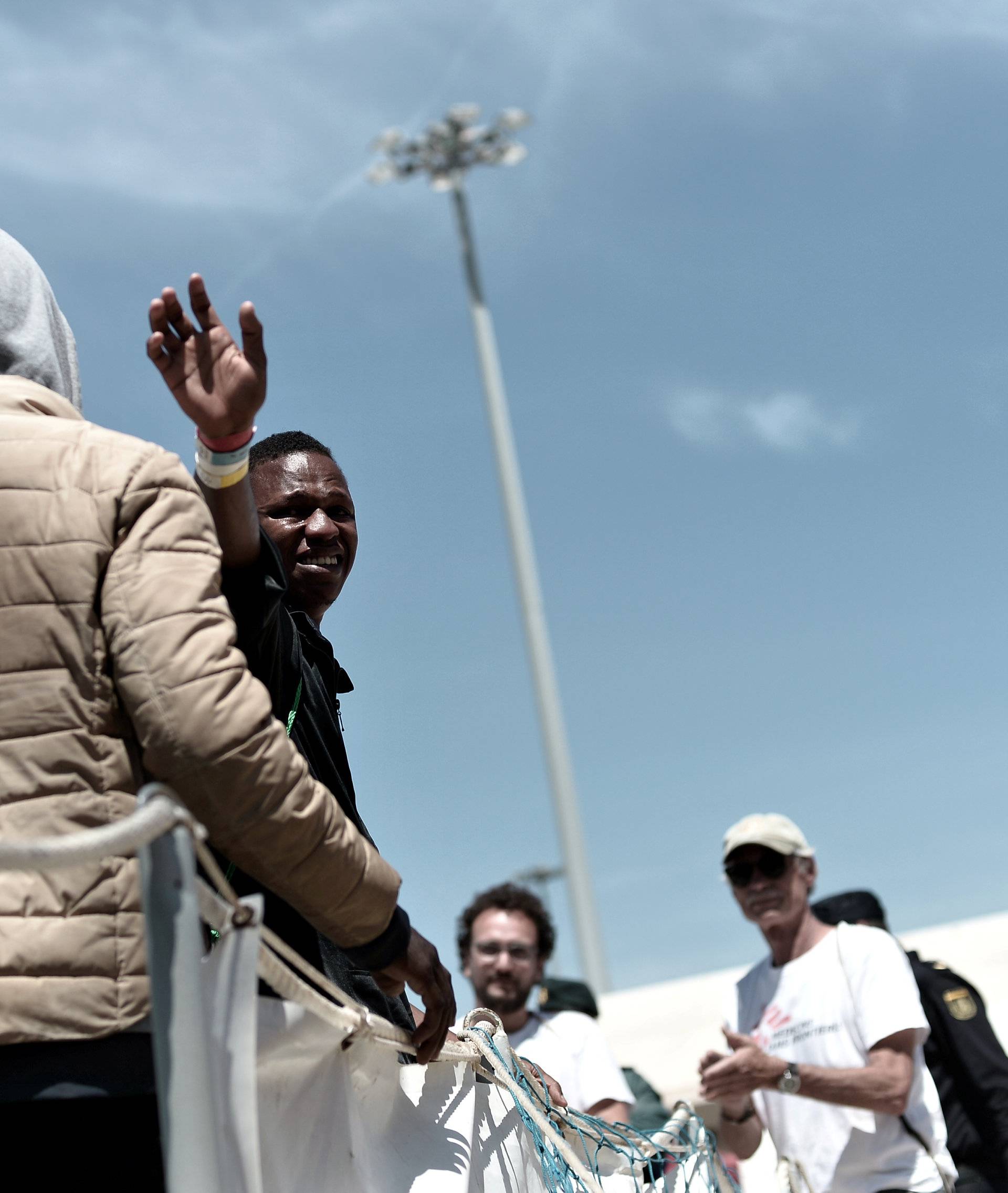 Migrants disembark from the Aquarius rescue ship after arriving to port in Valencia