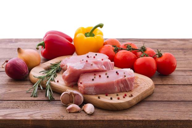 Raw pork meat on wooden desk