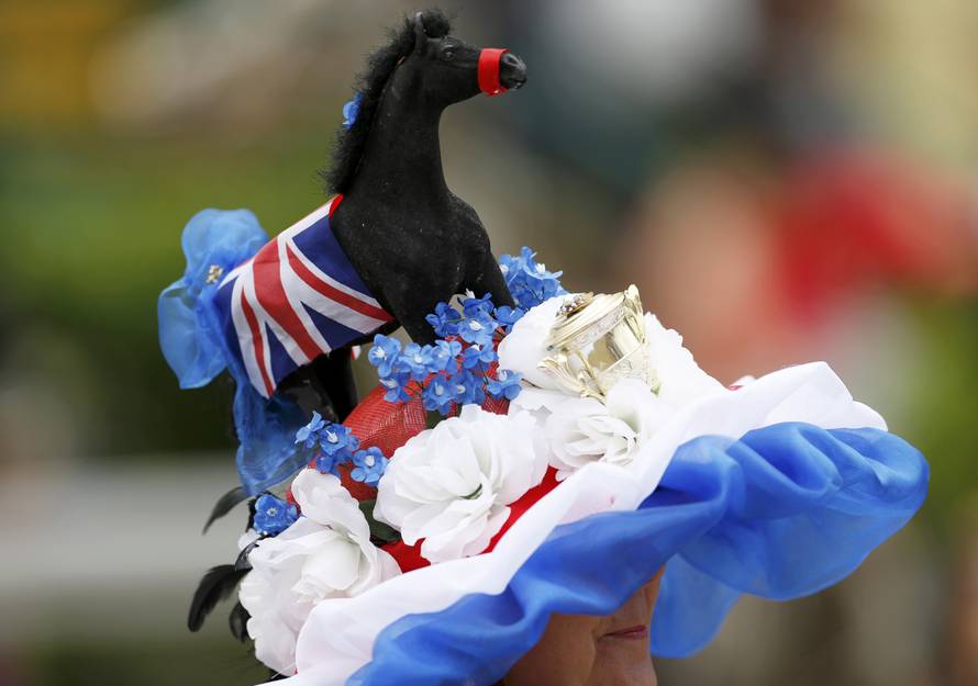 Britain Horse Racing Ladies Day Racegoer wears hat