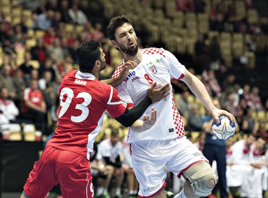 Habib Mohamed of Bahrain and Marko Kopljar of Croatia in action during their men's handball Olympic qualification match in Boxen