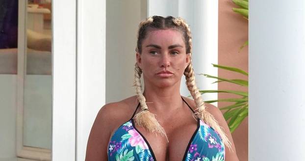 *EXCLUSIVE* WEB MUST CALL FOR PRICING  - Wearing her furry blue slippers and showing off the results of her biggest EVER boob job in her sexy multicoloured bikini, the British Glamour Model Katie Price is pictured enjoying her holiday in Thailand.*PICTUR