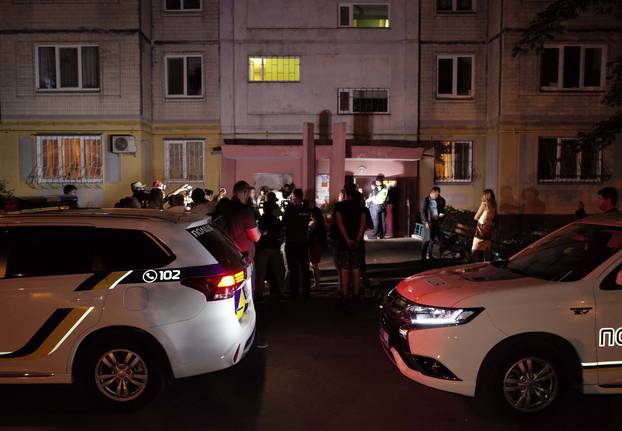 Police cars are seen parked in front of an apartment block where Russian journalist Arkady Babchenko was shot and died of his wounds in an ambulance, in Kiev