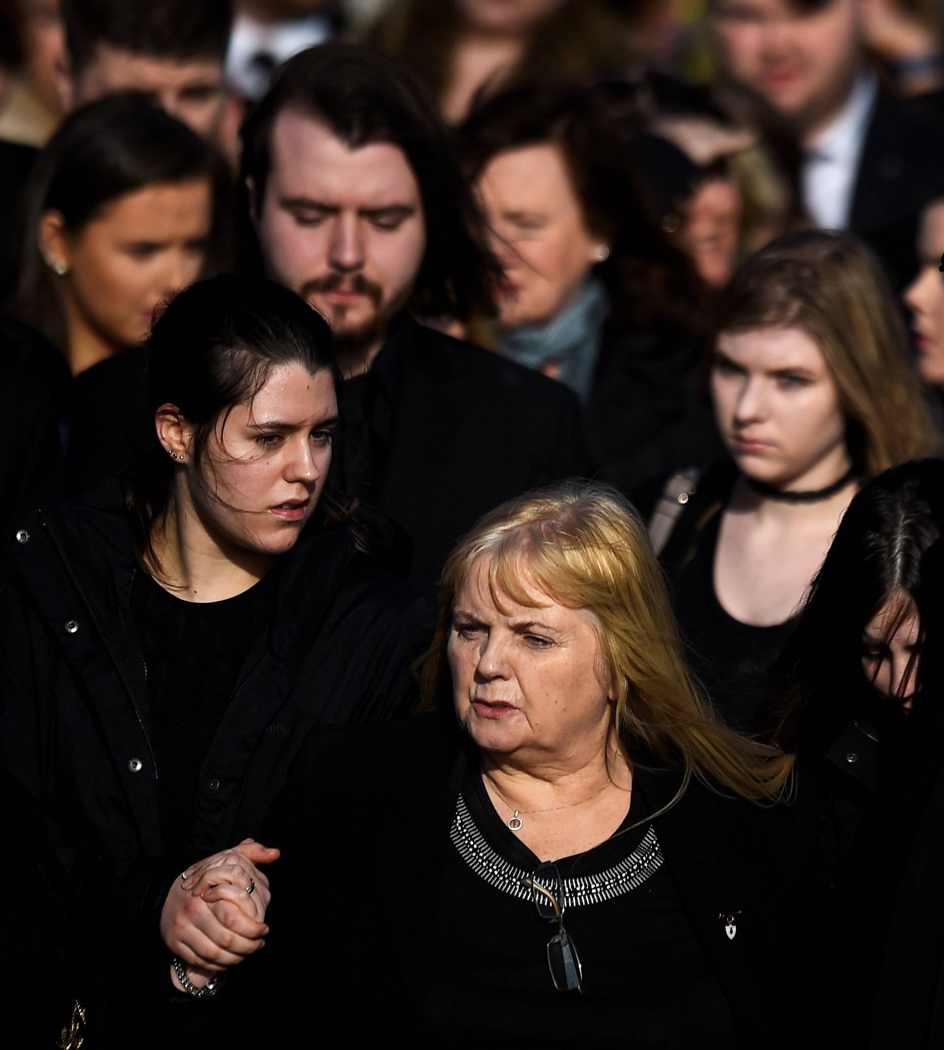 Eillen O'Riordan leaves her daughter Dolores O'Riordan's funeral with Dolores' ex-husband Don Burton and one of their daughters at St Ailbe's Church in Ballybricken