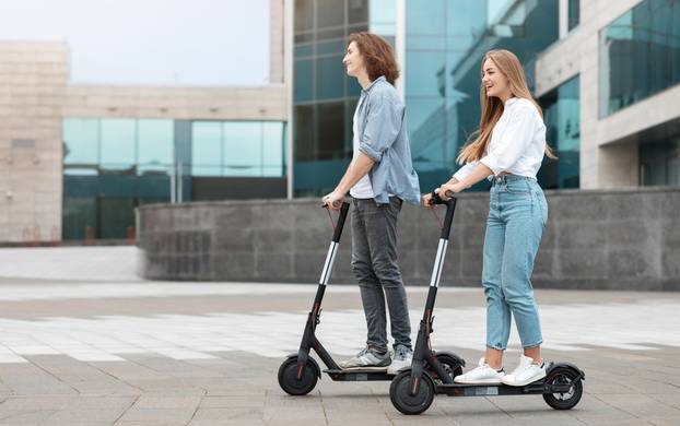 Full,Length,Profile,Side,View,Of,Smiling,Young,Couple,Driving