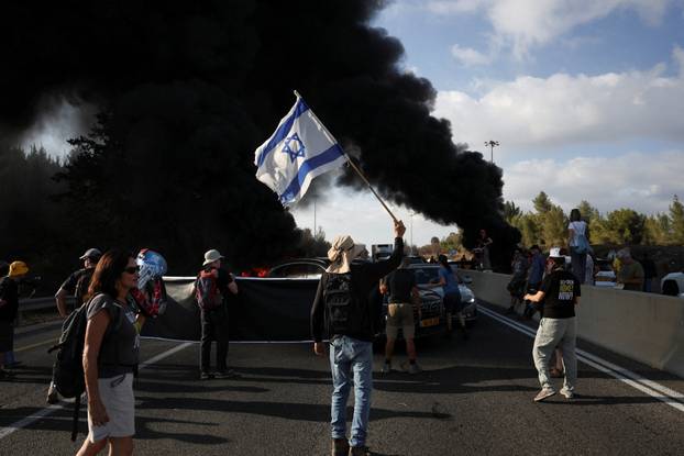 People block Israel's main highway connecting Jerusalem and Tel Aviv near Latrun