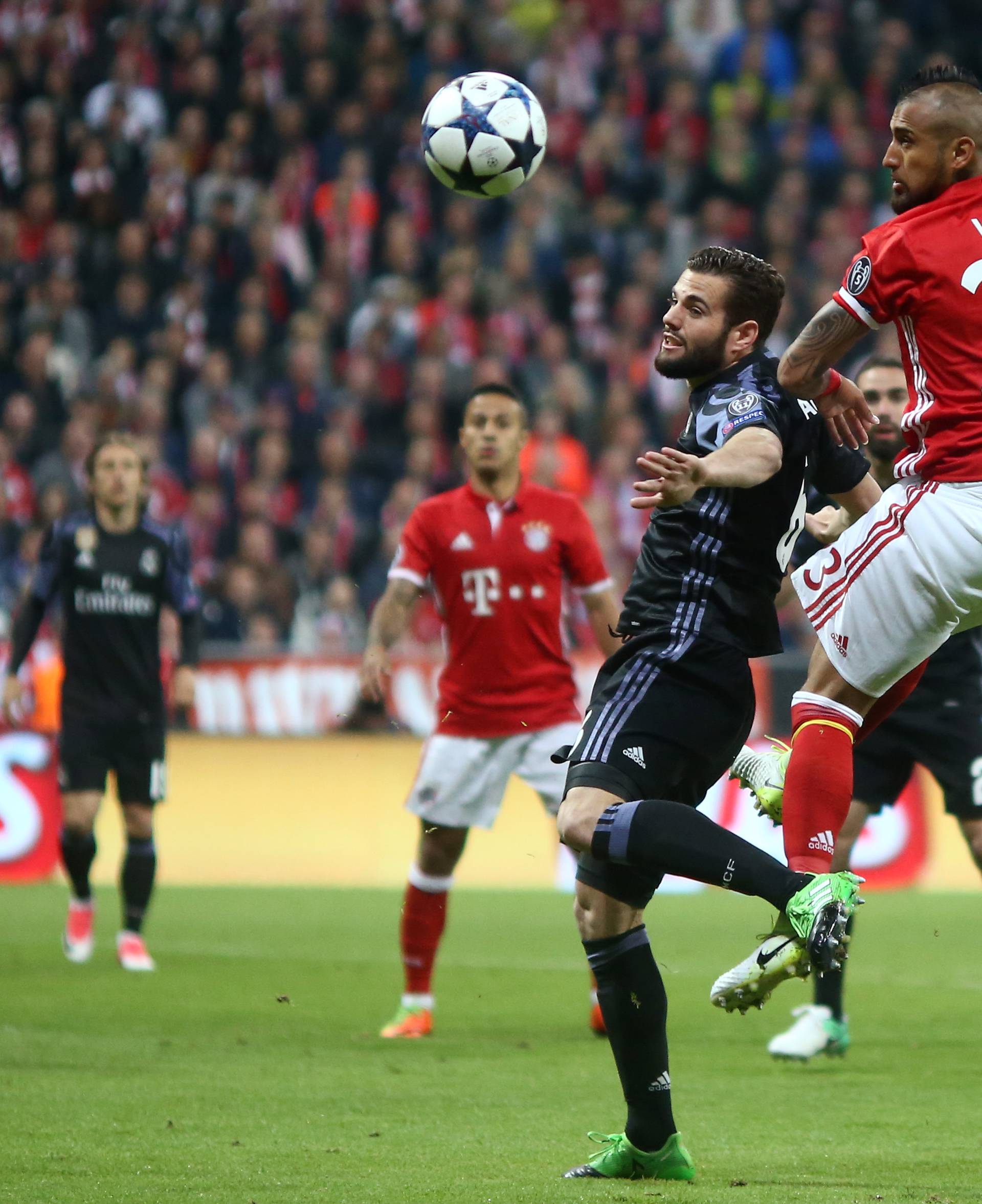 Bayern Munich's Arturo Vidal in action with Real Madrid's Nacho