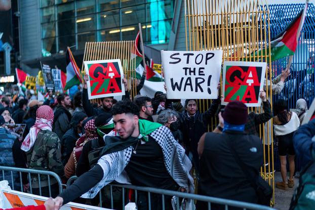 People attend a demonstration to express solidarity with Palestinians in Gaza in New York