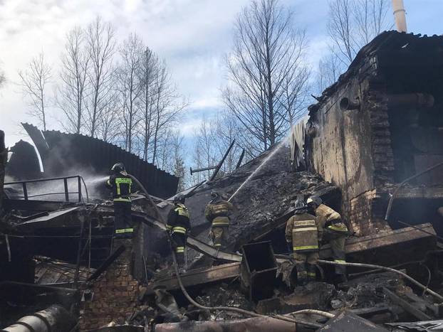 Firefighters work to put out a fire at a gunpowder and chemicals plant in Ryazan Region