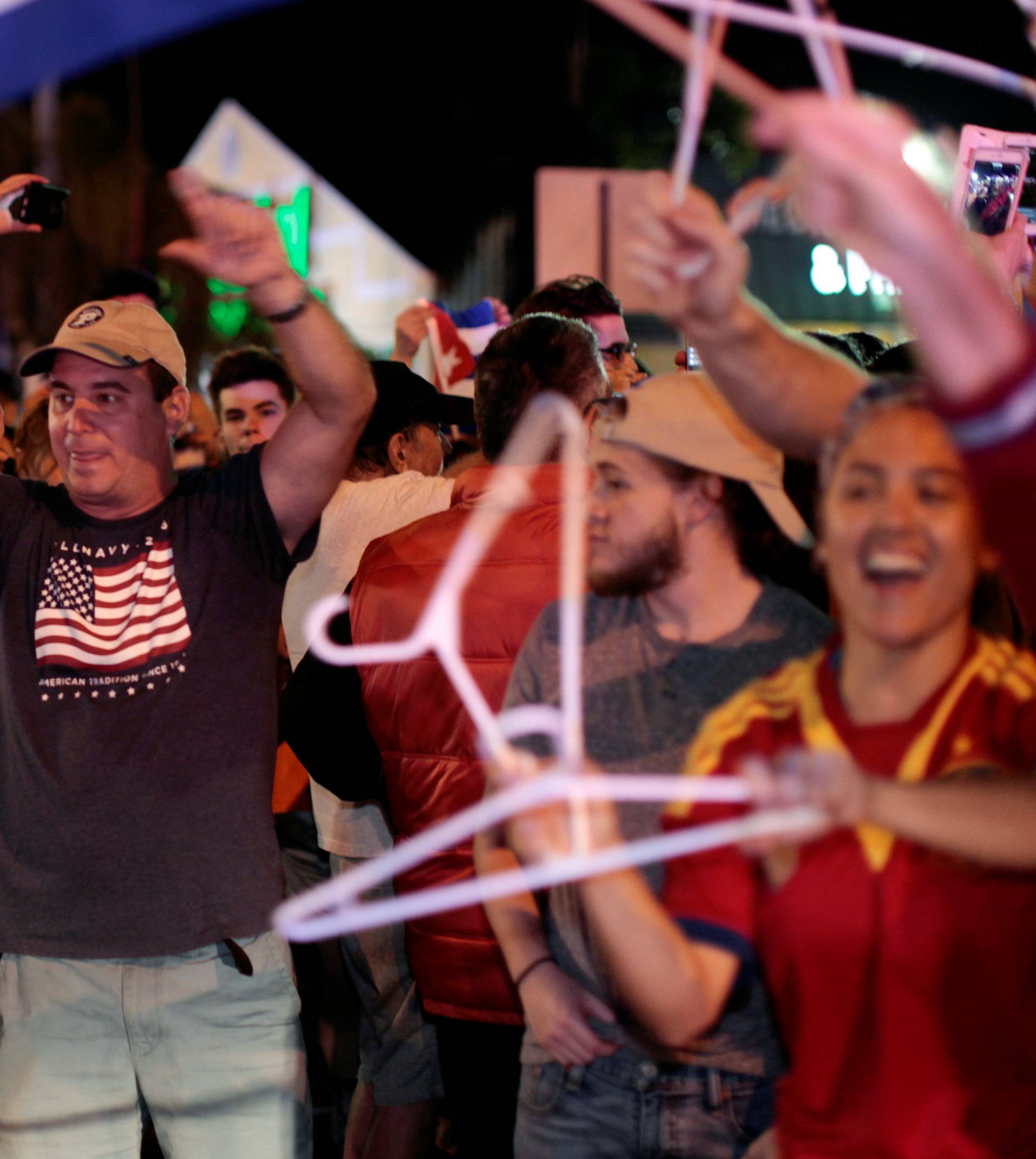 People celebrate after the announcement of the death of Cuban revolutionary leader Fidel Castro in the Little Havana district of Miami