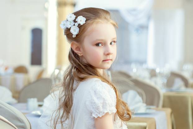 Cute little girl posing with hair decoration