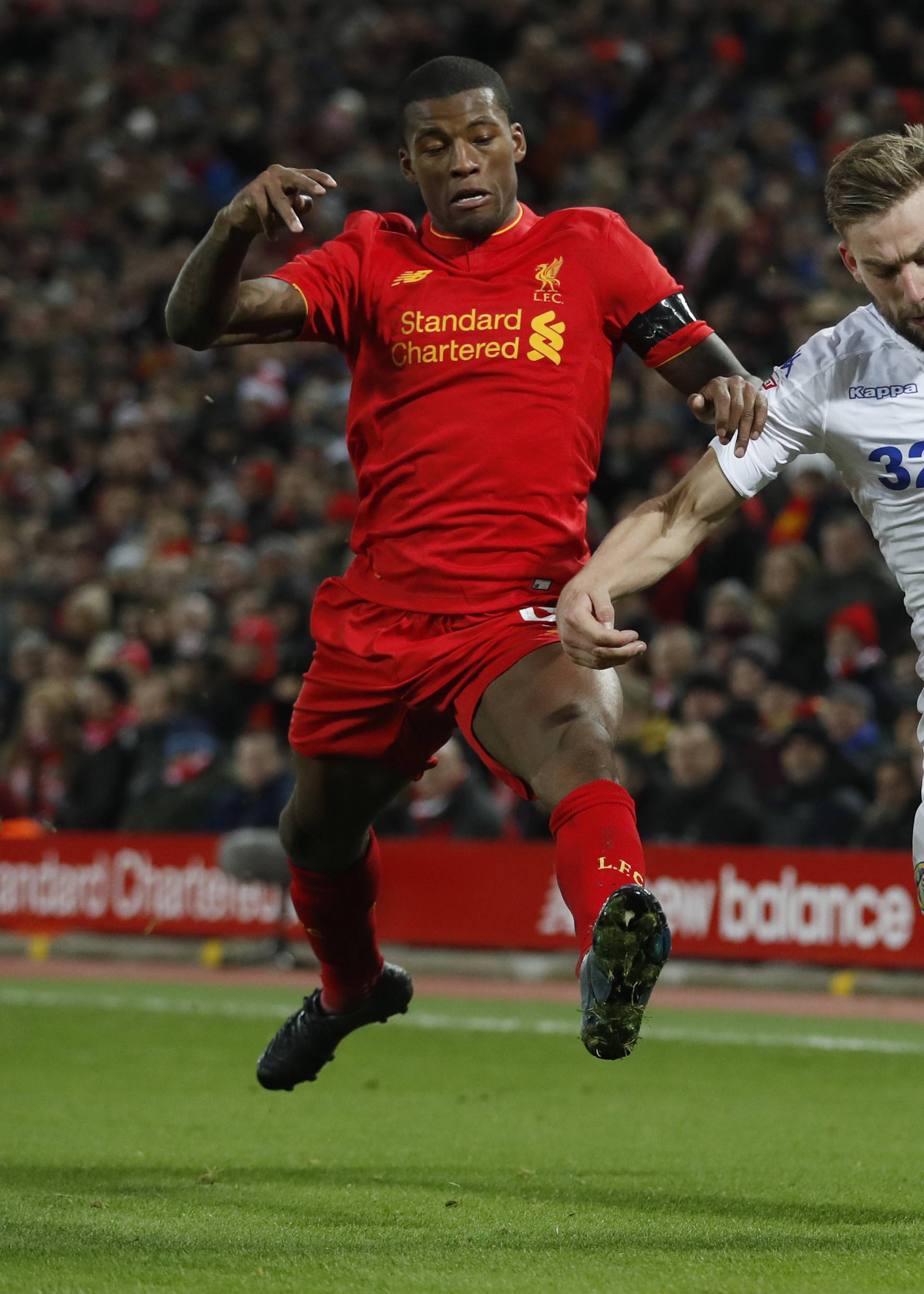 Liverpool's Georginio Wijnaldum in action with Leeds' Charlie Taylor