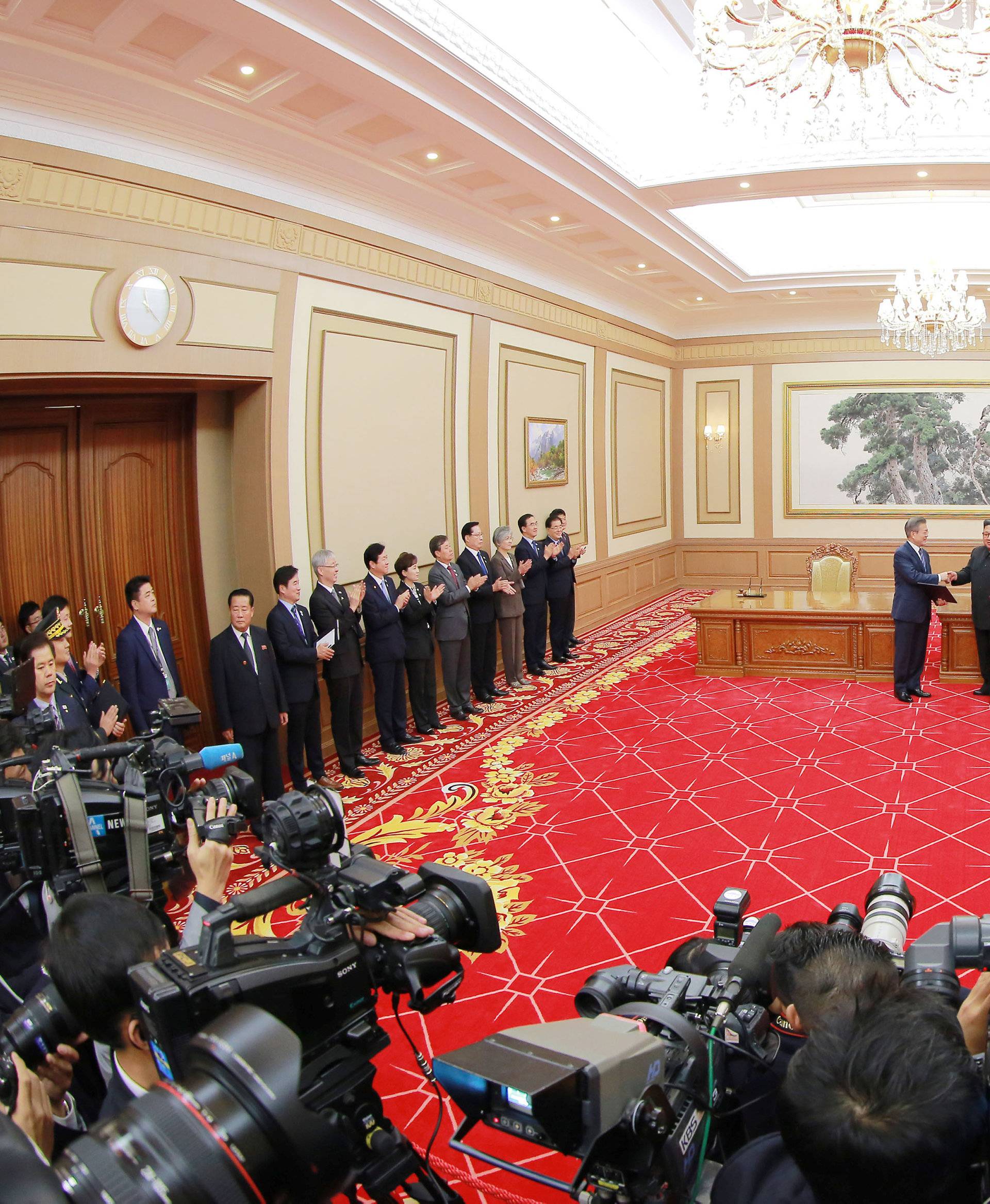 South Korean President Moon Jae-in and North Korean leader Kim Jong Un shake hands after signing a joint statement in Pyongyang in this photo released by North Korea's Korean Central News Agency