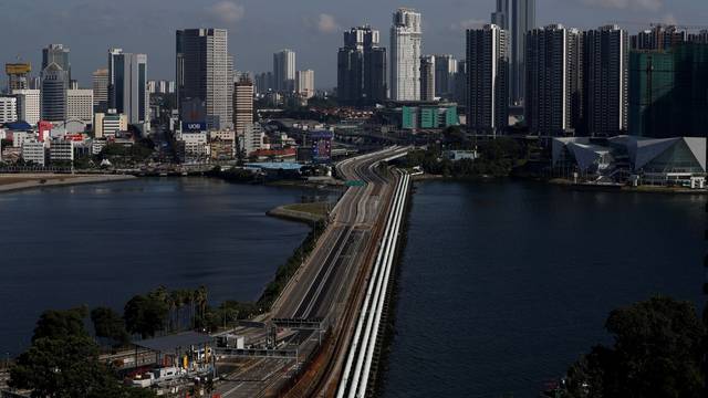 FILE PHOTO: A view of the empty Woodlands Causeway between Singapore and Malaysia after Malaysia imposed a lockdown on travel due to the coronavirus disease (COVID-19) outbreak