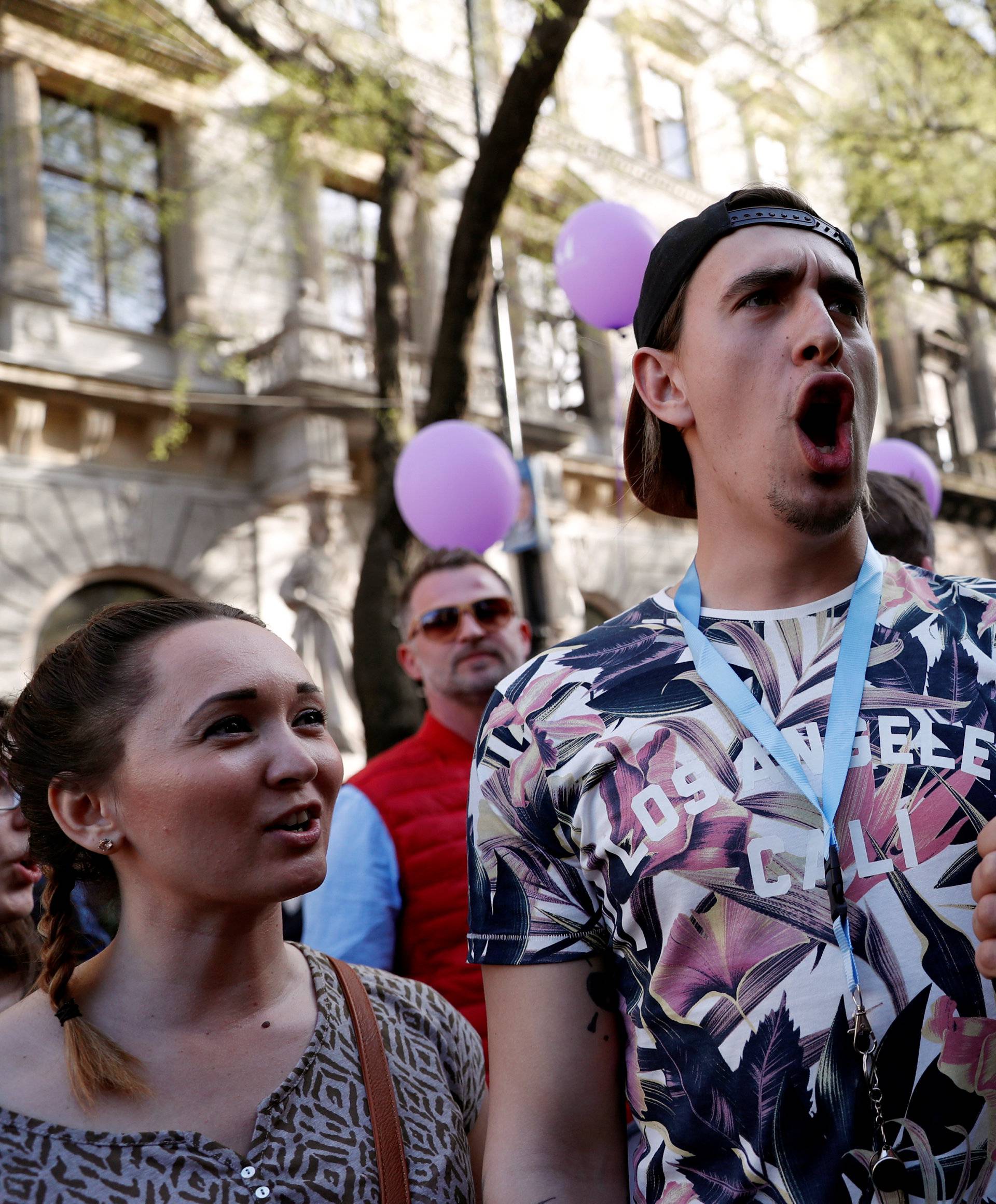 People attend a protest against the government of Prime Minister Viktor Orban in Budapest