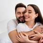 Photo of two people spouses have strong bonding feelings cuddle in house indoors