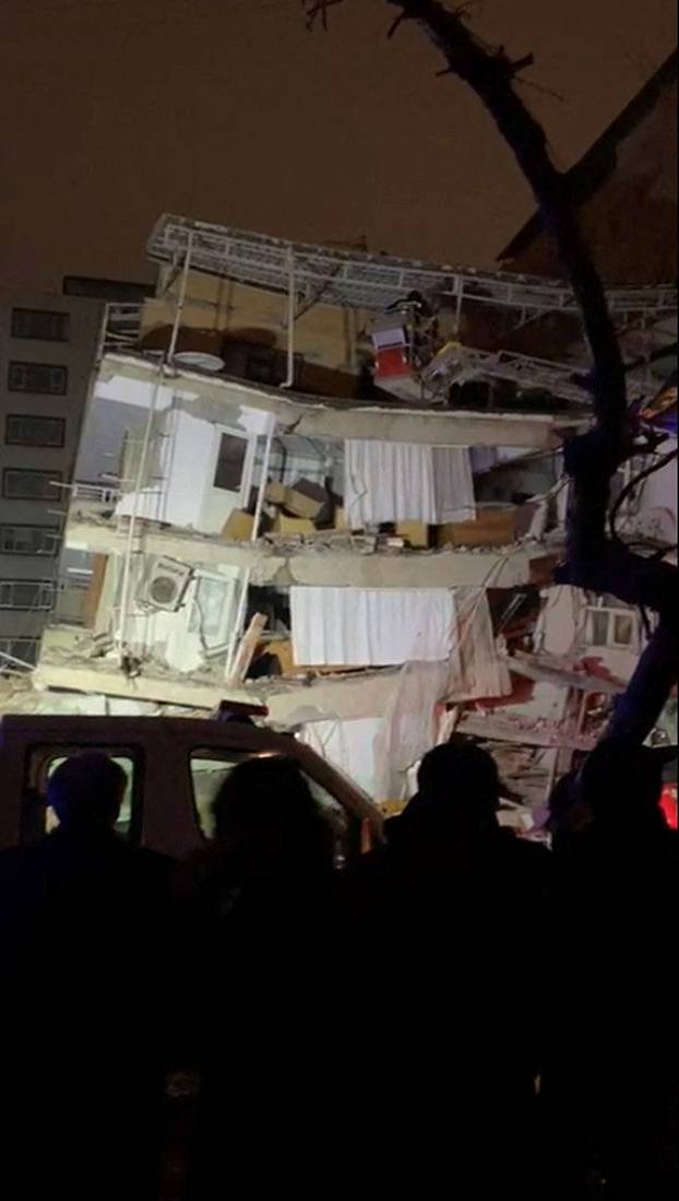 Emergency crew attends to a partially collapsed building following an earthquake in Diyarbakir