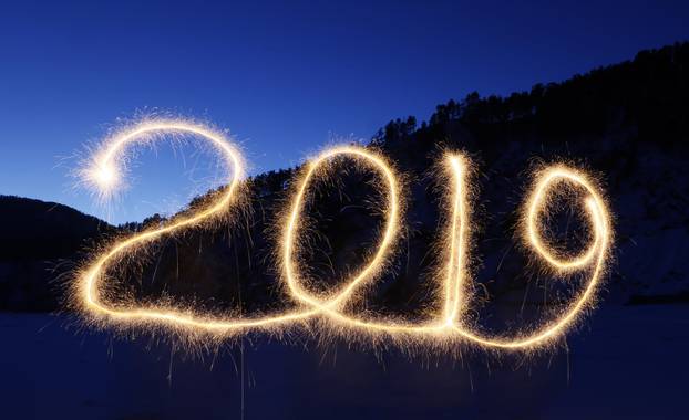 The numbers "2019" are written in the air with a sparkler near a tourist camp outside Krasnoyarsk