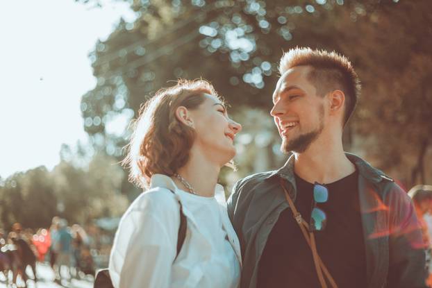 Romantic youth concept. Young stylish hipster couple in love at the city.