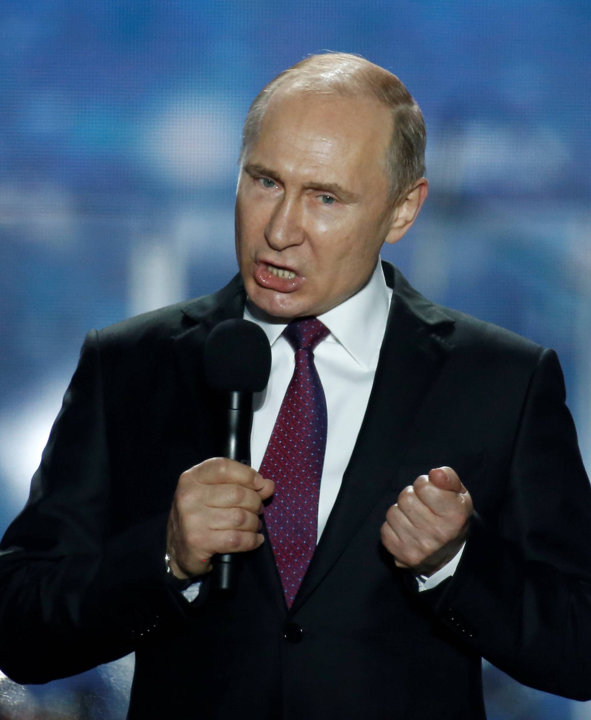 Russian president Vladimir Putin addresses the audience during a rally marking the fourth anniversary of Russia's annexation of Ukraine's Crimea region in the Black Sea port of Sevastopol