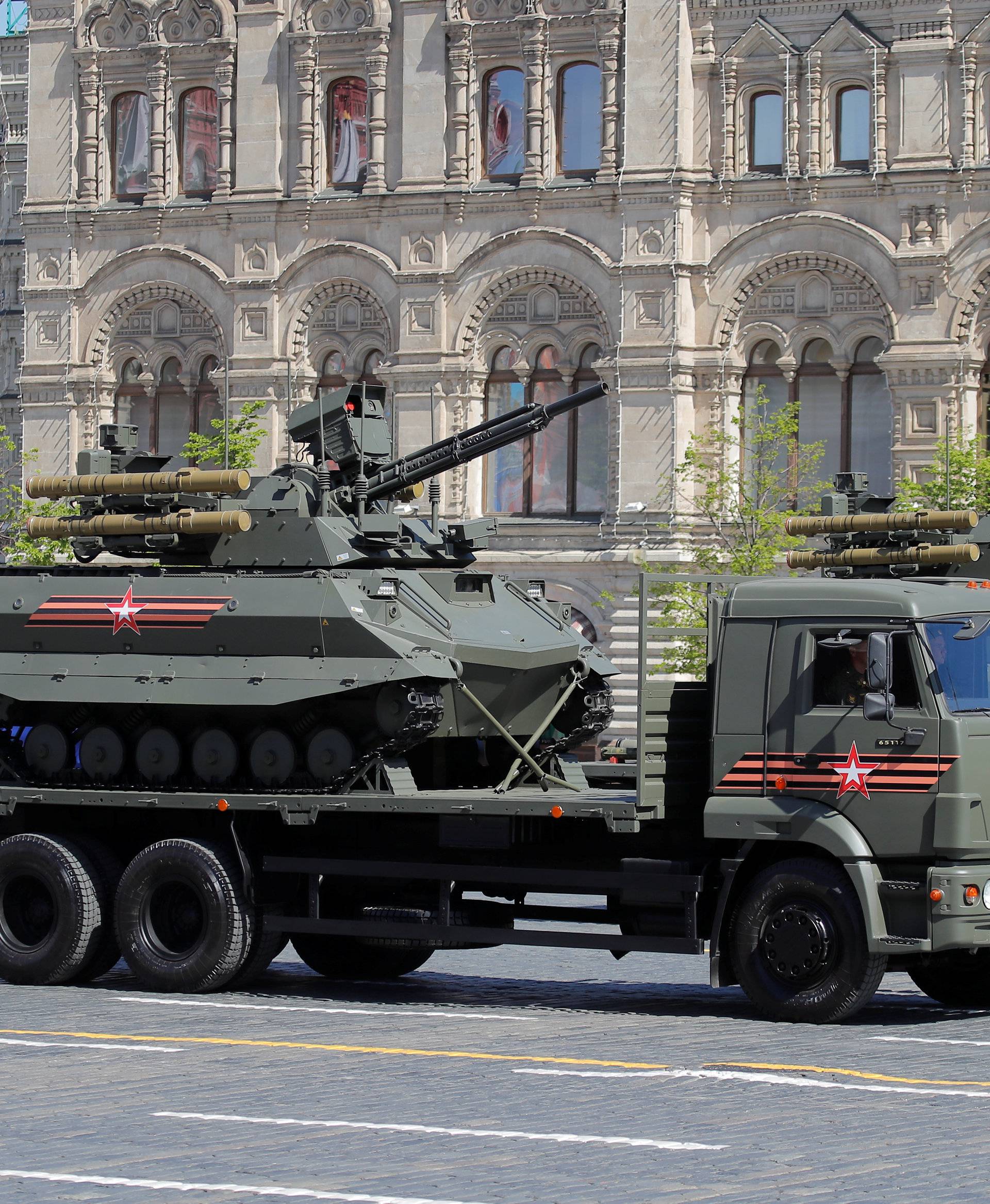 Russian servicemen drive military vehicles during the Victory Day parade at Red Square in Moscow