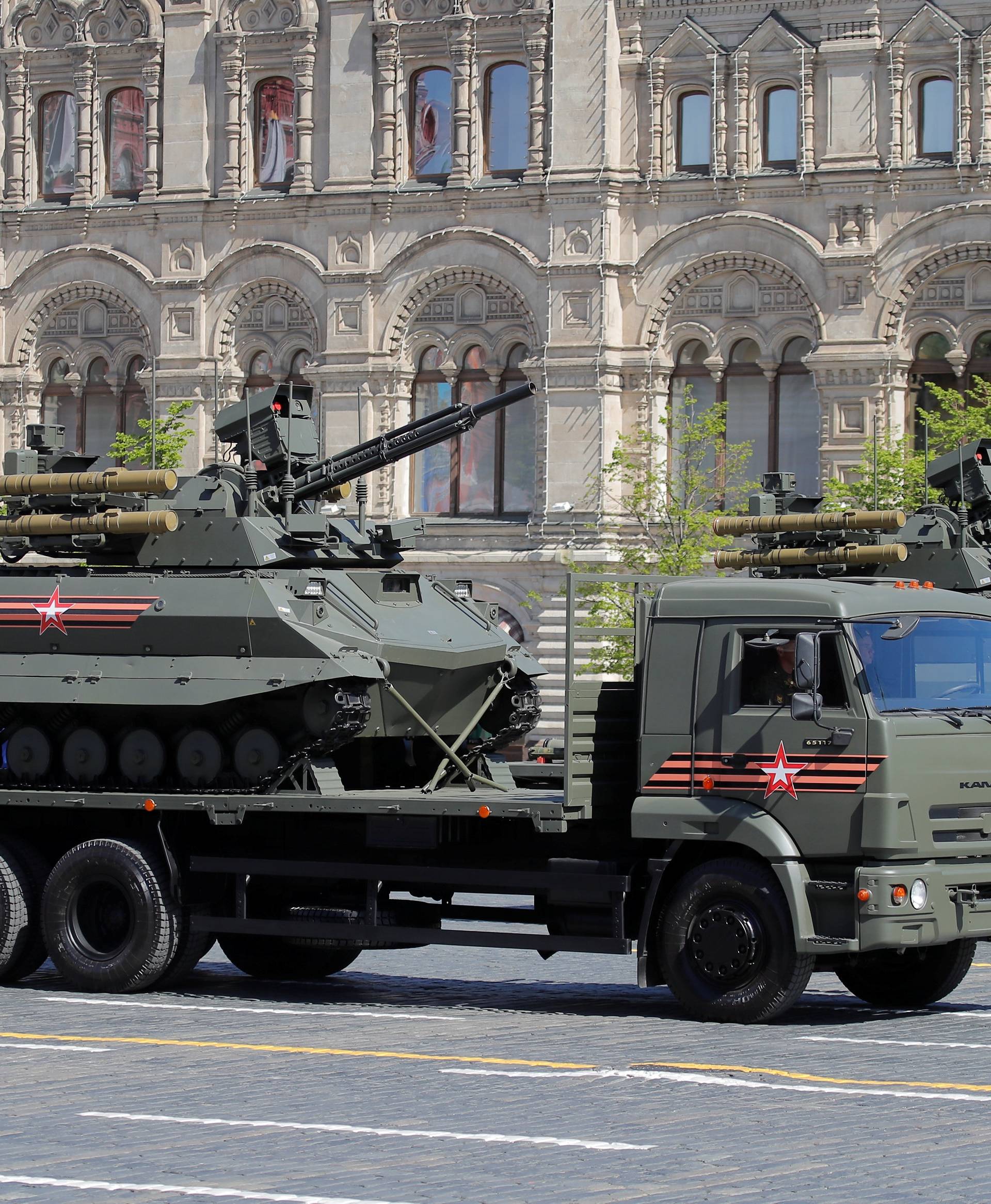 Russian servicemen drive military vehicles during the Victory Day parade at Red Square in Moscow