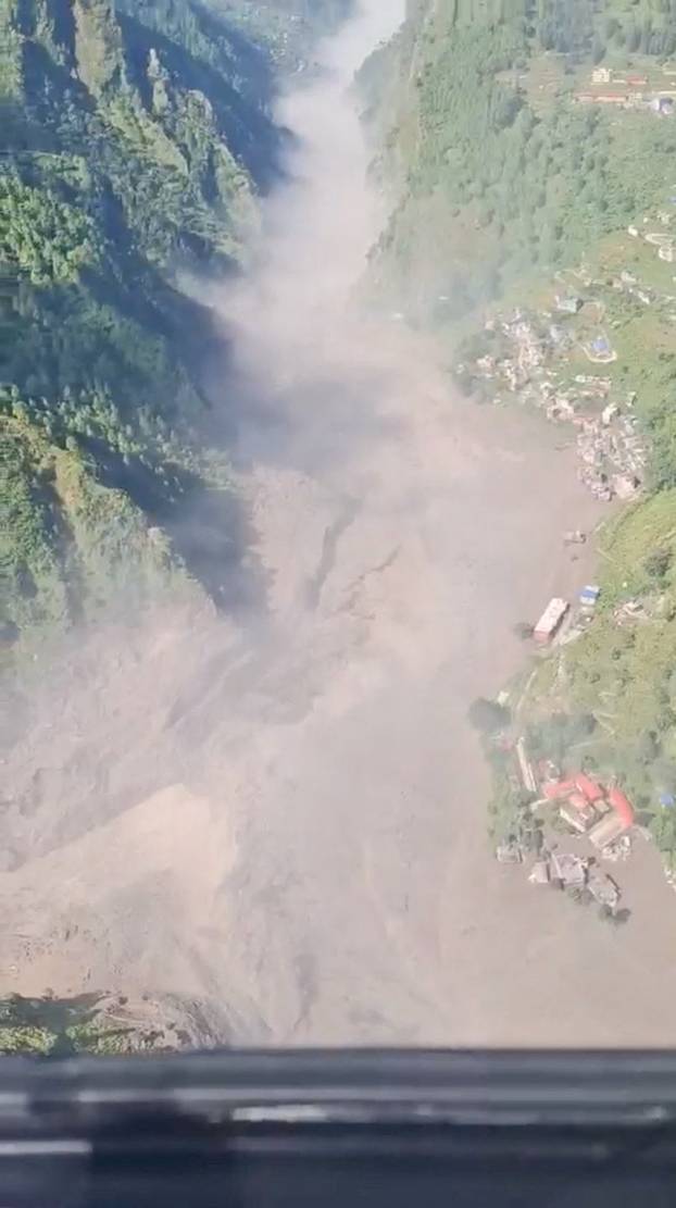 Helicopter footage shows flash flooding in Nepal's valleys of Rasuwa