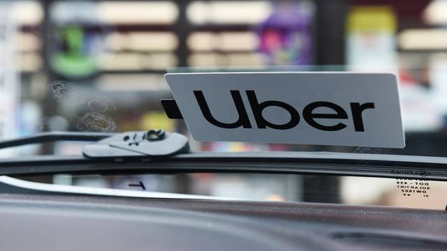 An Uber sticker is seen on Margaret Bordelon's car in Lafayette, Louisiana