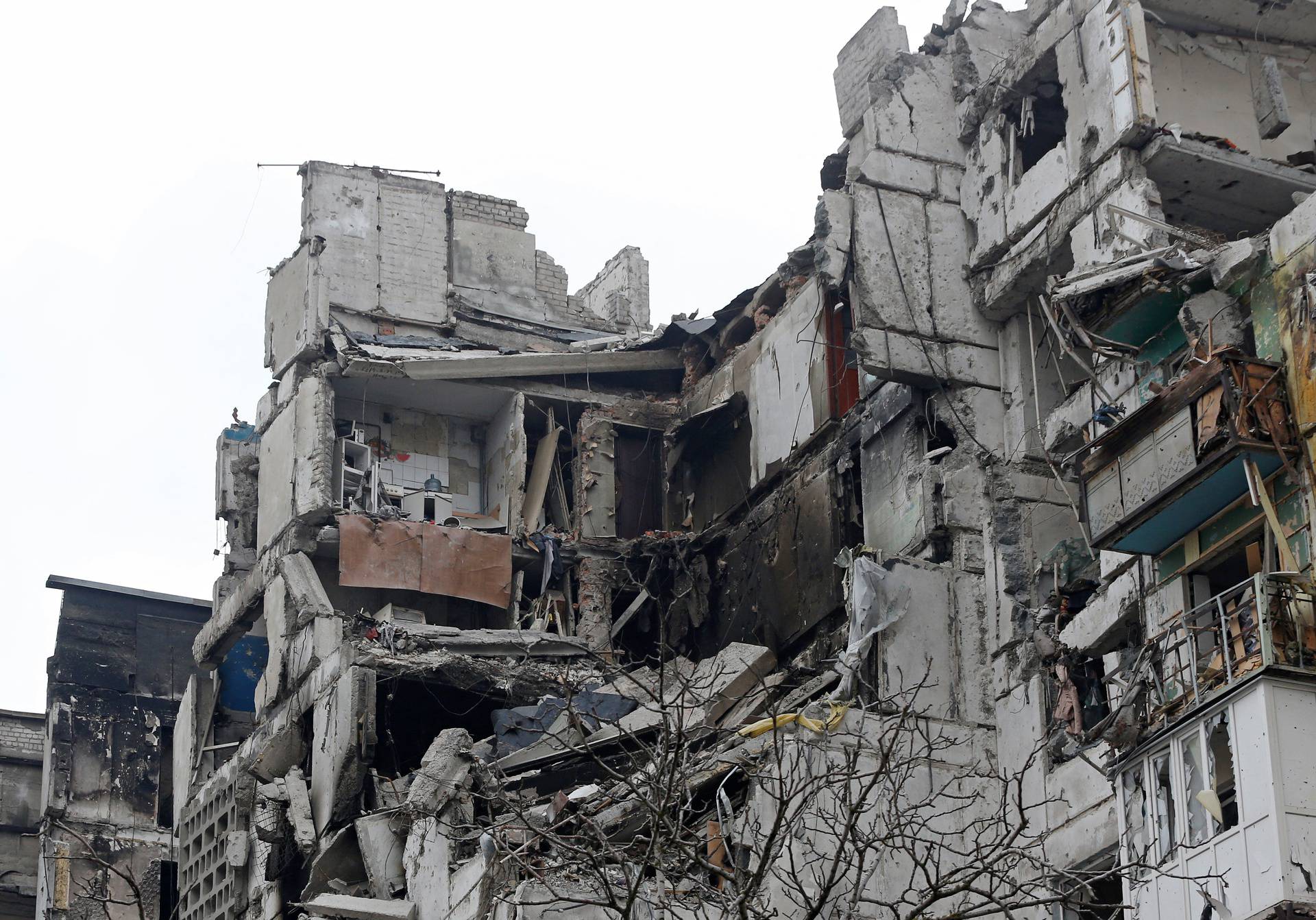 A view shows a heavily damaged apartment building in the besieged city of Mariupol