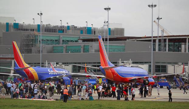 People on the airport ramp area near terminals 1 and 2 are seen following a shooting incident at Fort Lauderdale-Hollywood International Airport in Fort Lauderdale, Florida