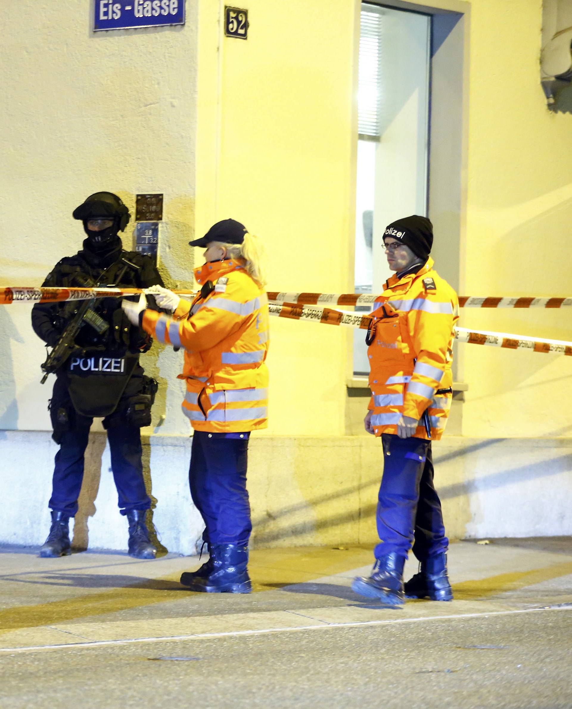 Police stand outside an Islamic center in central Zurich
