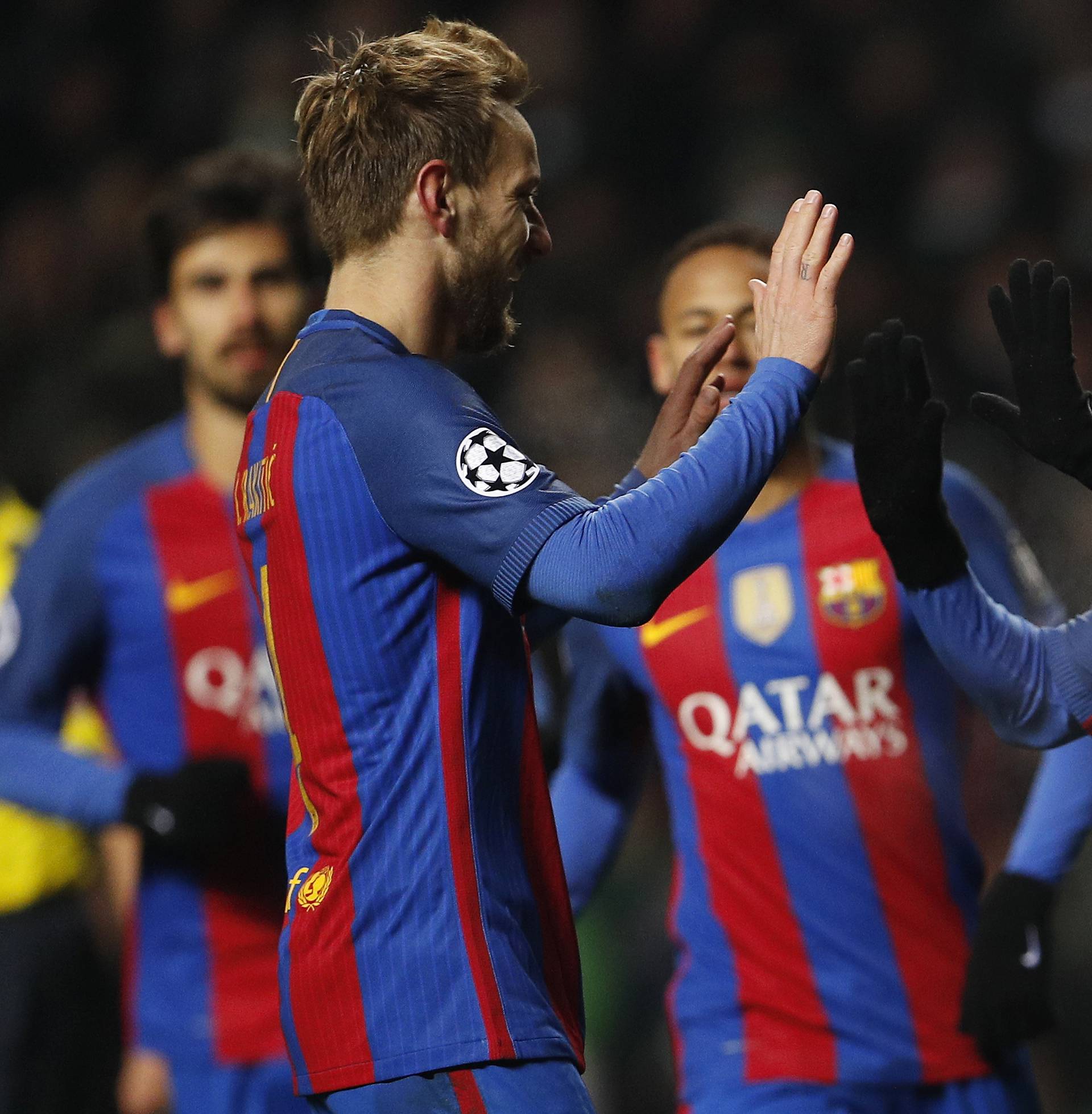 Barcelona's Lionel Messi celebrates scoring their second goal with Ivan Rakitic