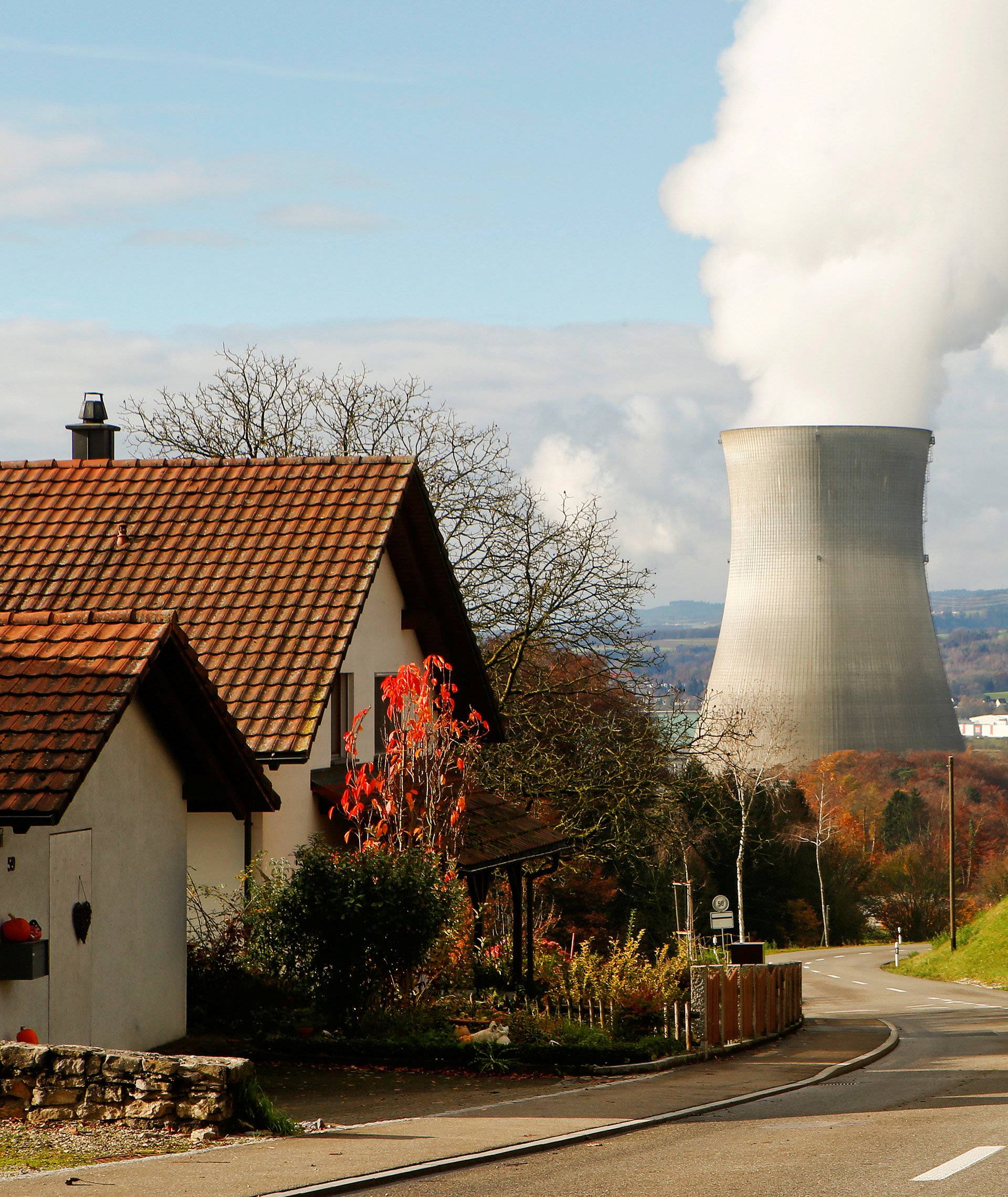 Steam emerges from a cooling tower of the nuclear power plant Leibstadt near Leibstadt