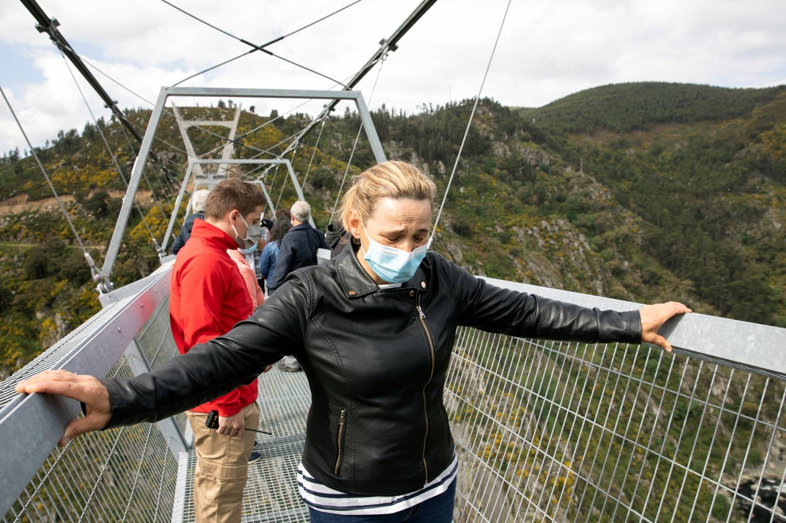 People walk on the world's longest pedestrian suspension bridge '516 Arouca', in Arouca