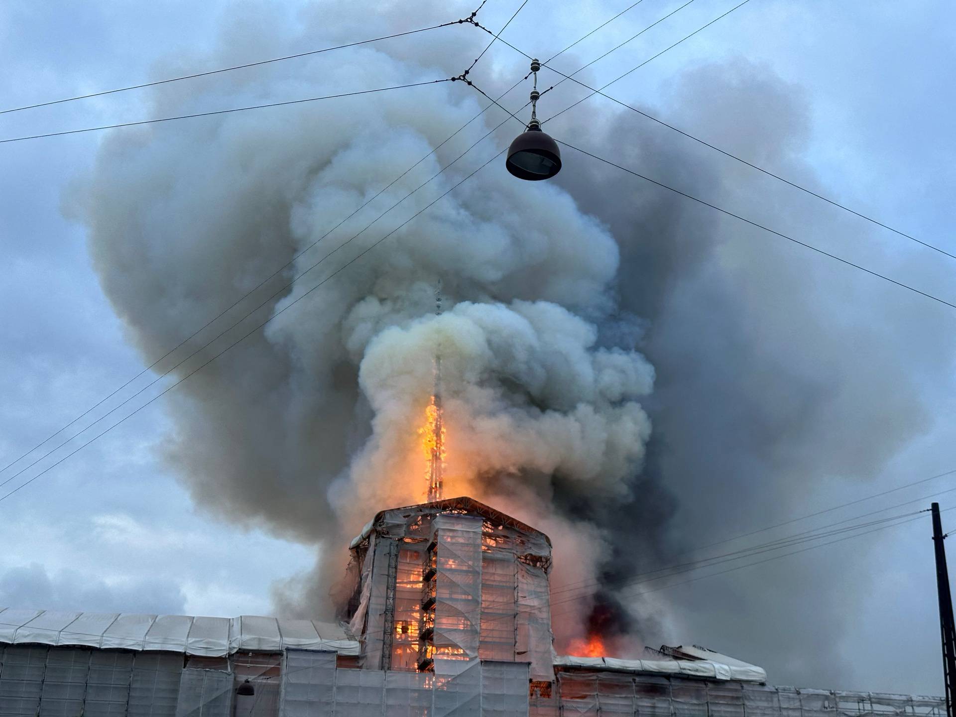 Smoke billows during a fire at the Old Stock Exchange, Boersen, in Copenhagen