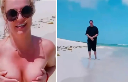 Britney se valjala po plaži bez grudnjaka, a hit postao čovjek u pozadini: 'Tko je ovaj tip!?'