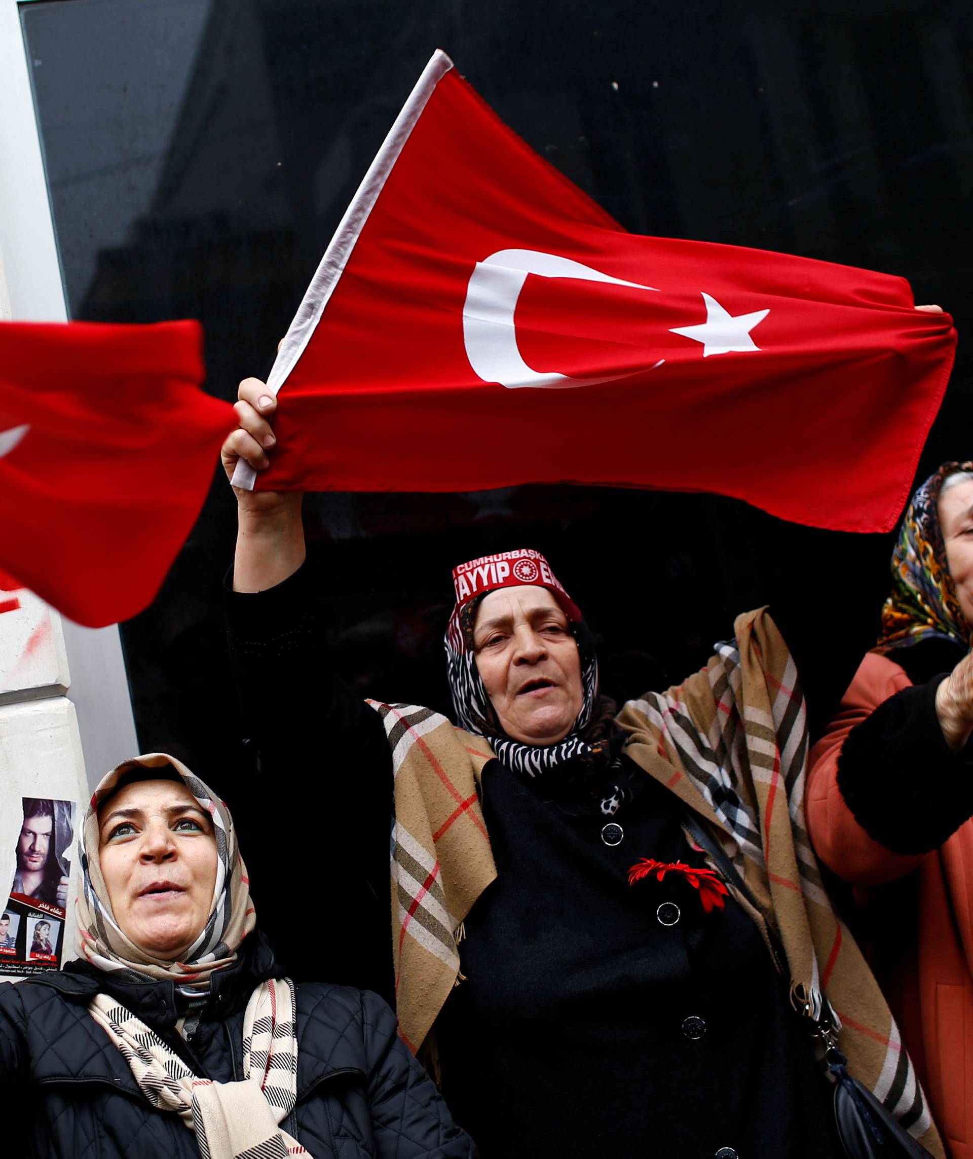 Demonstrators wave Turkish flags during a protest in front of the Dutch Consulate in Istanbul