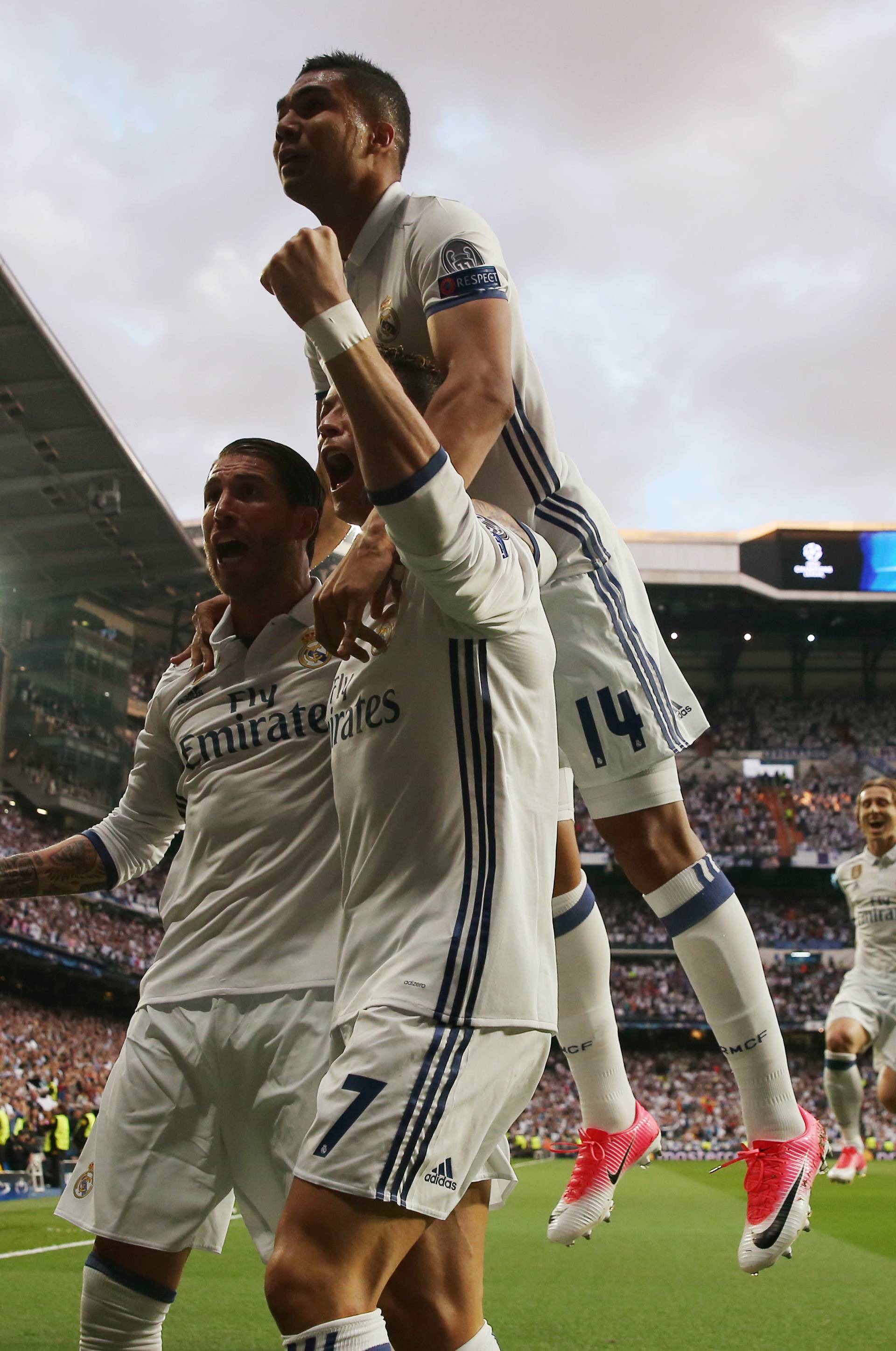 Real Madrid's Cristiano Ronaldo celebrates scoring their first goal with Sergio Ramos and Casemiro