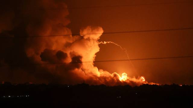 Smoke and flames rise during Israeli strikes in the Gaza Strip, as seen from the Israeli side of the border with Gaza