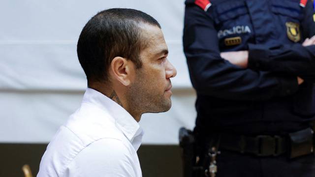 Brazil soccer player Dani Alves sits in court during the first day of his trial in Barcelona