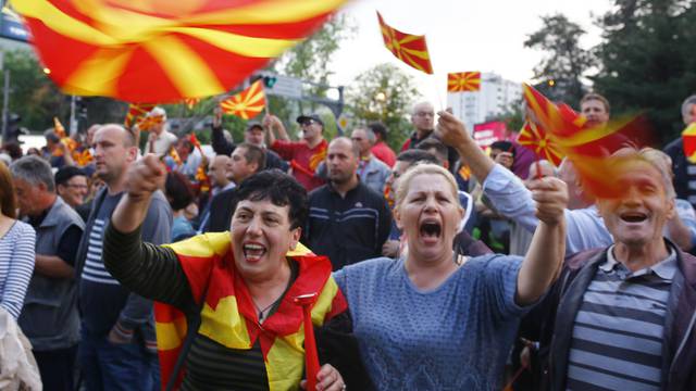 Protesters demonstrate in front of the EU Info Center building in Skopje