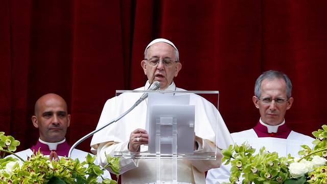 Pope Francis delivers his Easter message in the Urbi et Orbi (to the city and the world) address from the balcony overlooking St. Peter's Square at the Vatican