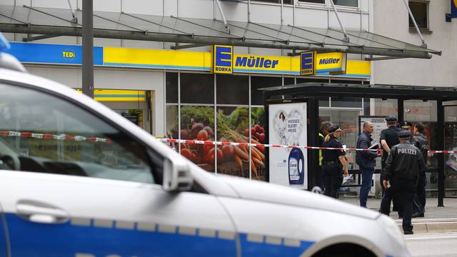 Security forces are seen after a knife attack in a supermarket in Hamburg