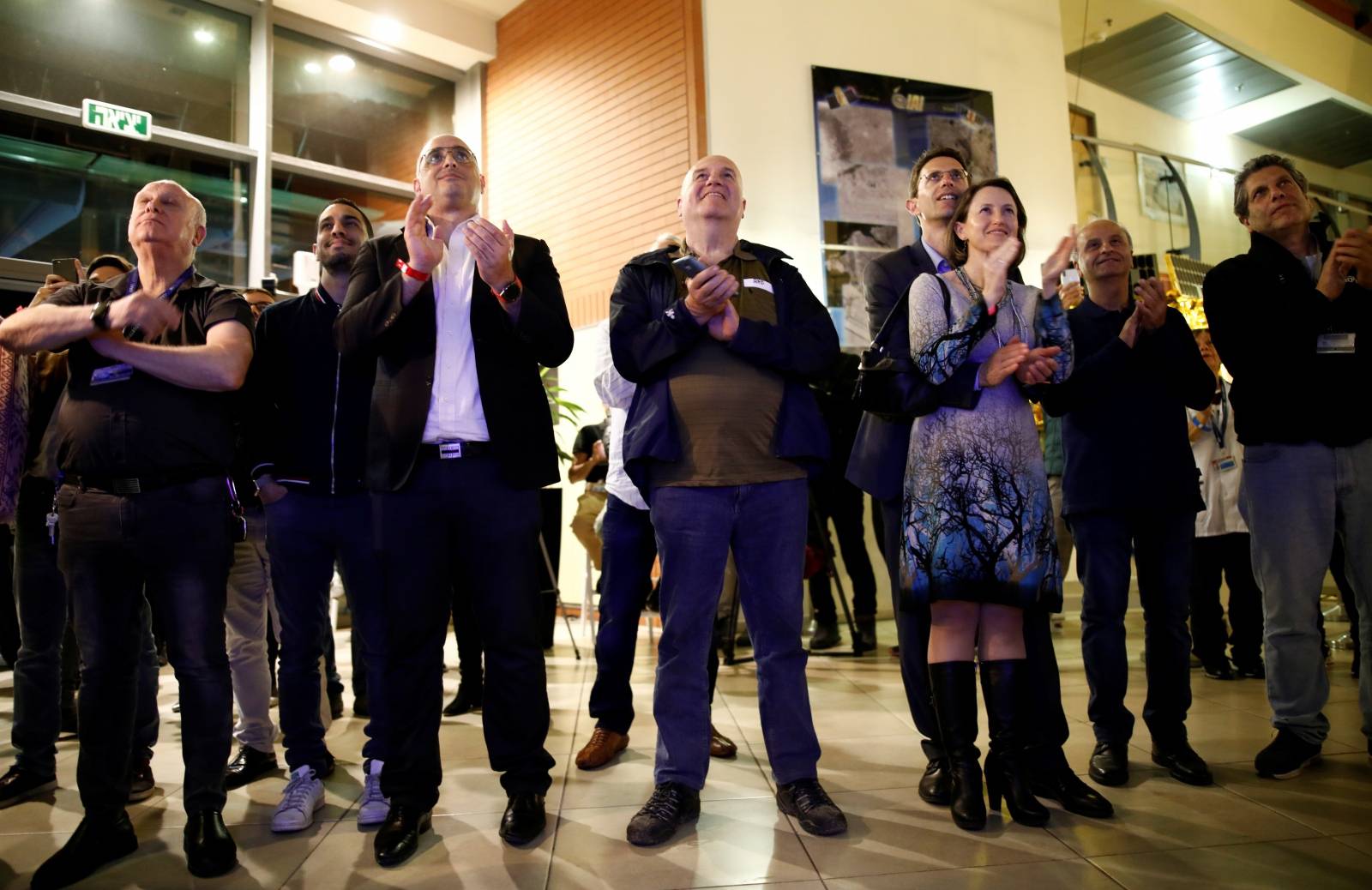 People react as they observe Israeli spacecraft, Beresheet's landing on the moon, outside the control room at Israel Aerospace Industries (IAI) site in Yehud